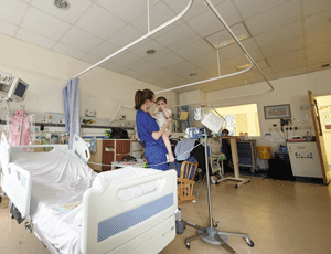 A nurse and a child on a ward