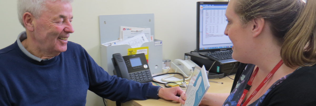 Patient George Coldrake  discusses his care plan with ILD clinical nurse specialist Charlotte Hogben