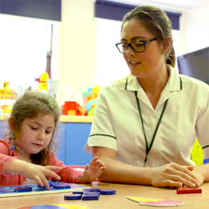 Occupational therapist working with a paediatric patient