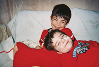 Alexander playing at home with his older brother, Christopher