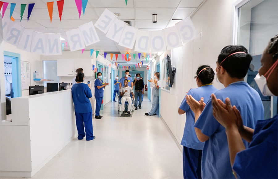 Raj is cheered by staff as he leaves hospital