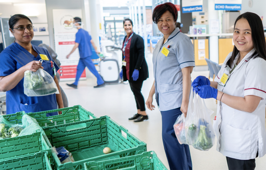 Staff at Harefield receiving a donation of fresh vegetables from Waitrose