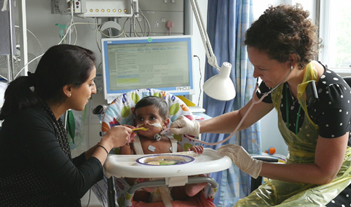 Feeding a baby in a high chair