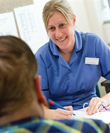 Nurse speaking with a patient 