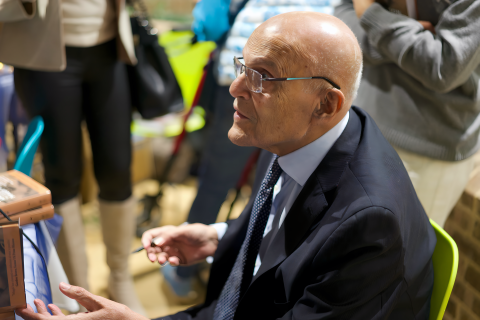 Professor Yacoub signing copies of his book
